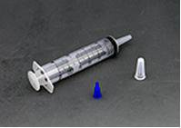 Medical syringe with a blue cap and white plunger on a gray background